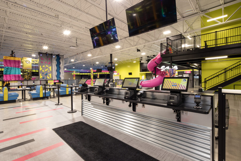 interior, Urban Air, check in area with play gym in background